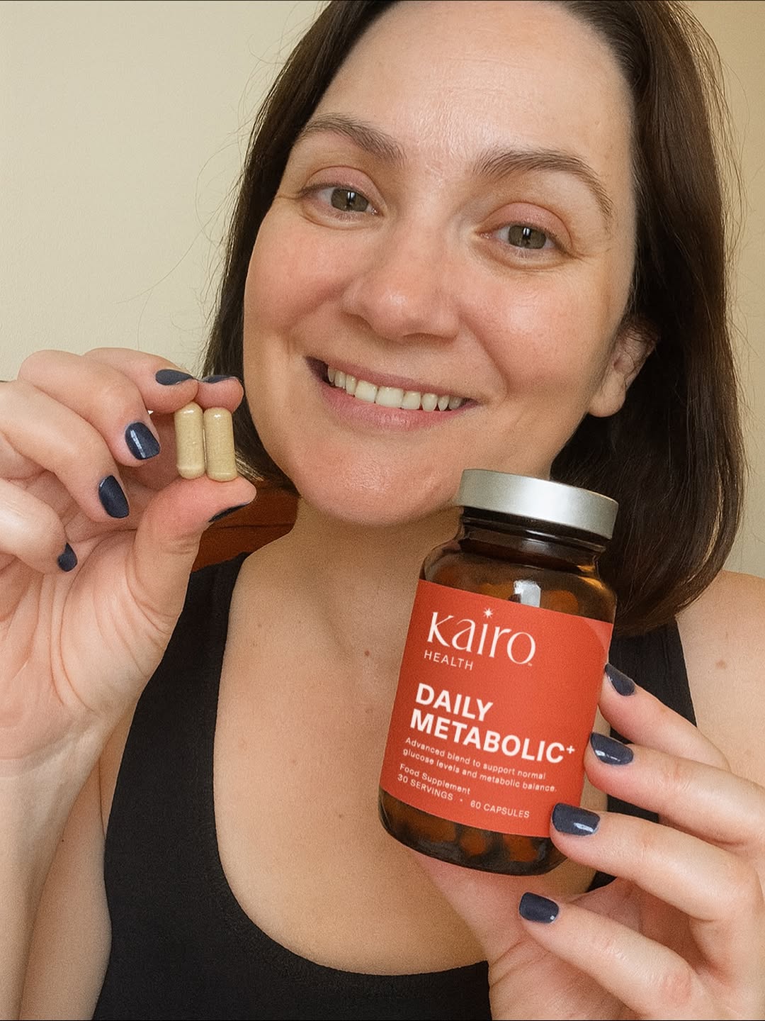 Customer holding Kairo capsules